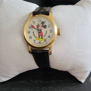 Mickey Mouse Gold Watch with Black Sea Snake Strap. 7.625" L. Needs Battery